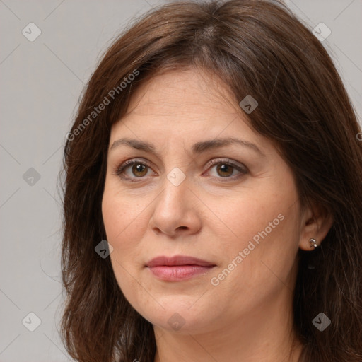 Joyful white adult female with medium  brown hair and brown eyes