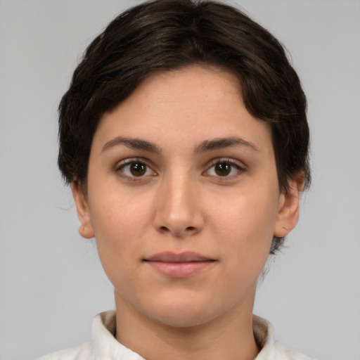 Neutral white young-adult female with short  brown hair and brown eyes