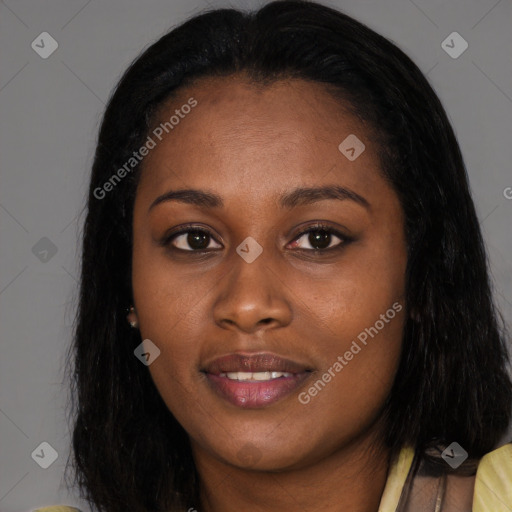 Joyful black young-adult female with long  black hair and brown eyes