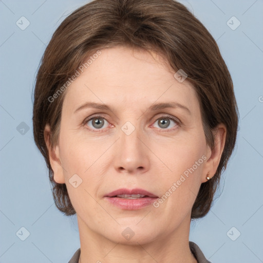 Joyful white adult female with medium  brown hair and grey eyes