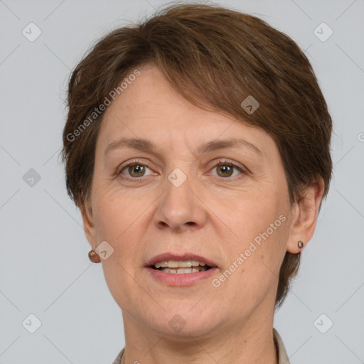 Joyful white adult female with short  brown hair and grey eyes