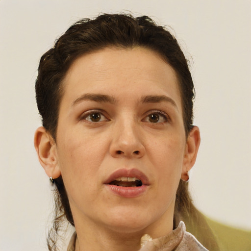 Joyful white adult female with short  brown hair and brown eyes