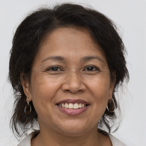 Joyful asian adult female with medium  brown hair and brown eyes