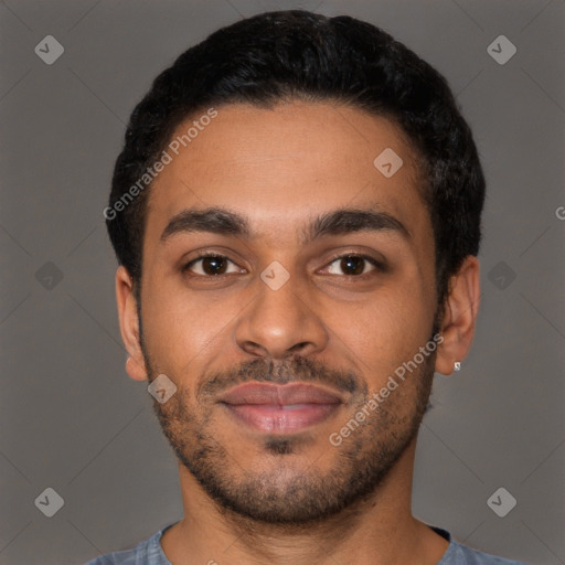 Joyful latino young-adult male with short  brown hair and brown eyes