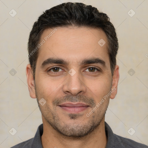 Joyful white young-adult male with short  black hair and brown eyes