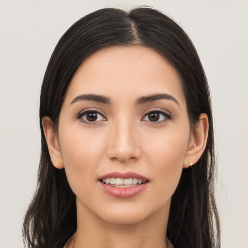 Joyful white young-adult female with long  brown hair and brown eyes