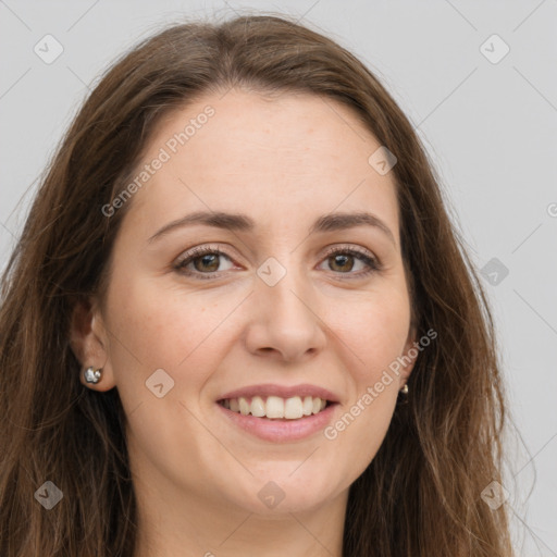 Joyful white young-adult female with long  brown hair and green eyes