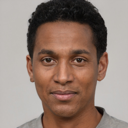 Neutral black young-adult male with short  black hair and brown eyes
