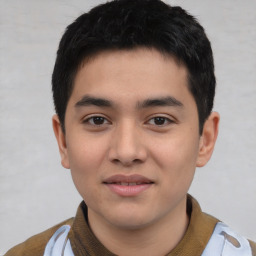 Joyful asian young-adult male with short  black hair and brown eyes