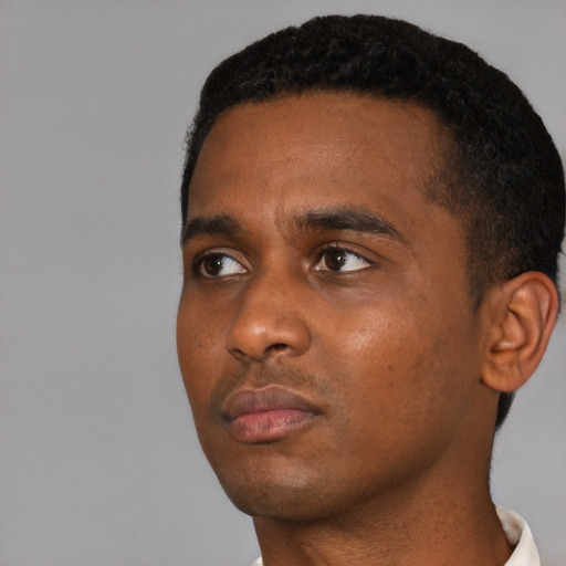 Neutral black young-adult male with short  black hair and brown eyes