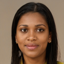 Joyful black young-adult female with long  brown hair and brown eyes