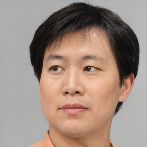 Neutral asian young-adult male with short  black hair and brown eyes