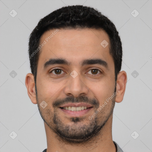 Joyful white young-adult male with short  black hair and brown eyes