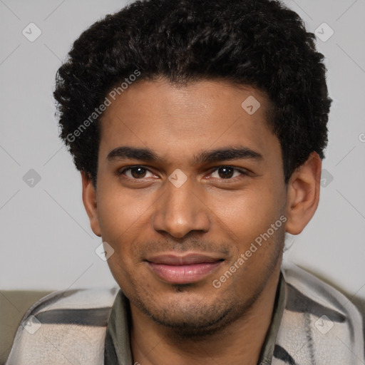 Joyful black young-adult male with short  brown hair and brown eyes