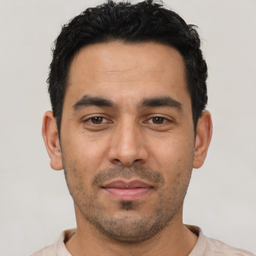 Neutral latino young-adult male with short  black hair and brown eyes