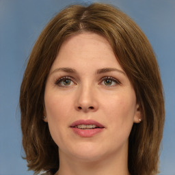 Joyful white young-adult female with medium  brown hair and green eyes