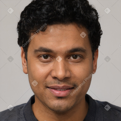 Joyful white young-adult male with short  black hair and brown eyes