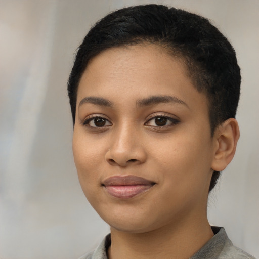 Joyful latino young-adult female with short  black hair and brown eyes