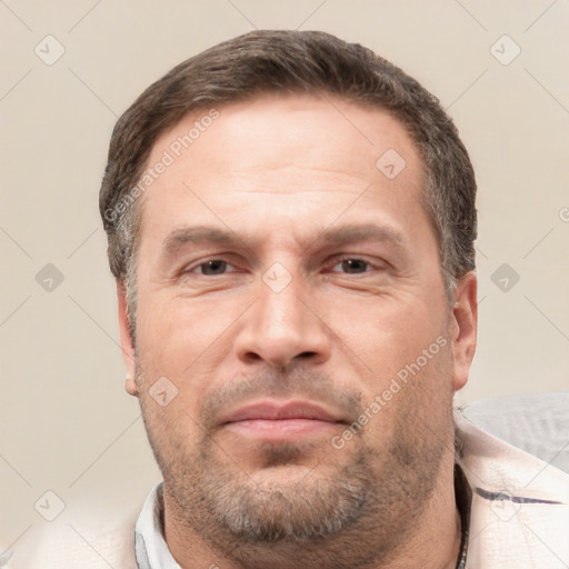 Neutral white adult male with short  brown hair and brown eyes