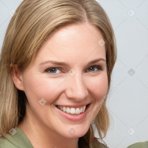 Joyful white young-adult female with medium  brown hair and blue eyes