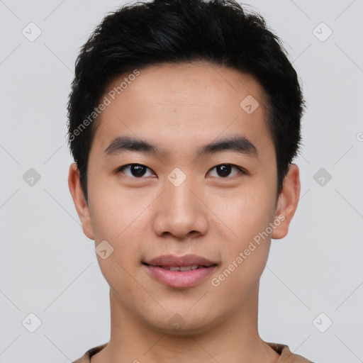 Joyful asian young-adult male with short  black hair and brown eyes