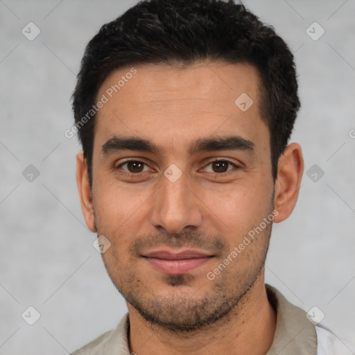 Joyful white young-adult male with short  black hair and brown eyes