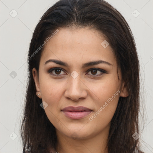 Joyful latino young-adult female with long  brown hair and brown eyes