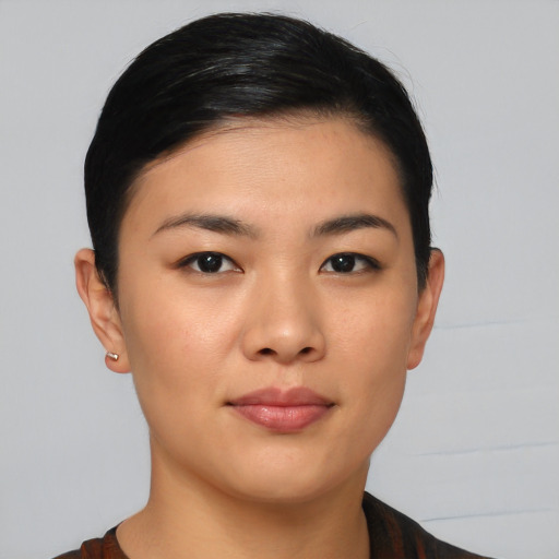 Joyful asian young-adult female with short  black hair and brown eyes