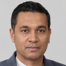 Neutral white adult male with short  black hair and brown eyes