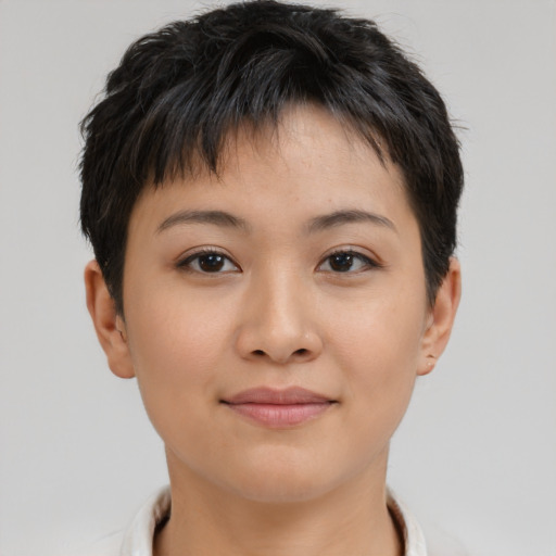 Joyful asian young-adult female with short  brown hair and brown eyes