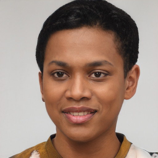 Joyful black young-adult female with short  black hair and brown eyes