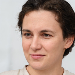 Joyful white adult female with short  brown hair and brown eyes