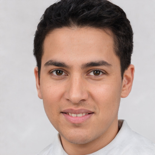 Joyful white young-adult male with short  brown hair and brown eyes