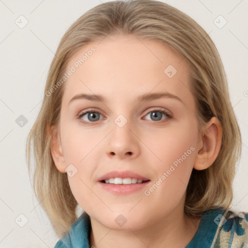 Joyful white young-adult female with medium  brown hair and blue eyes