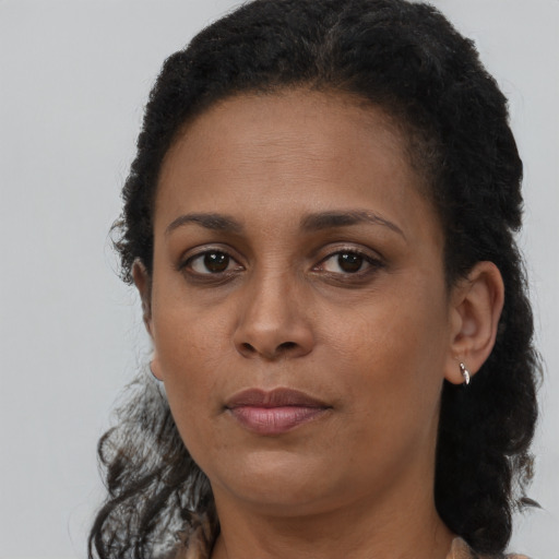 Neutral black adult female with short  brown hair and brown eyes