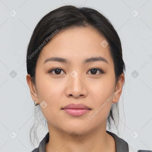 Joyful asian young-adult female with medium  black hair and brown eyes