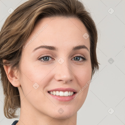 Joyful white young-adult female with medium  brown hair and green eyes