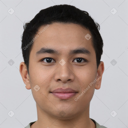 Joyful asian young-adult male with short  black hair and brown eyes