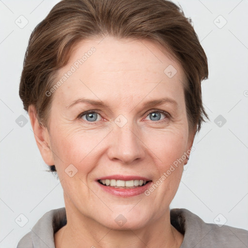 Joyful white adult female with short  brown hair and grey eyes