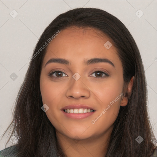 Joyful latino young-adult female with long  black hair and brown eyes