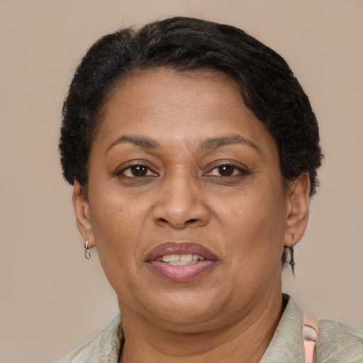 Joyful latino adult female with short  brown hair and brown eyes