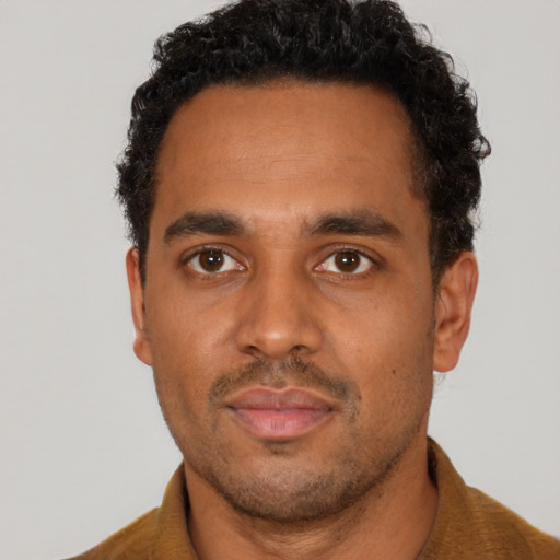 Neutral black adult male with short  brown hair and brown eyes