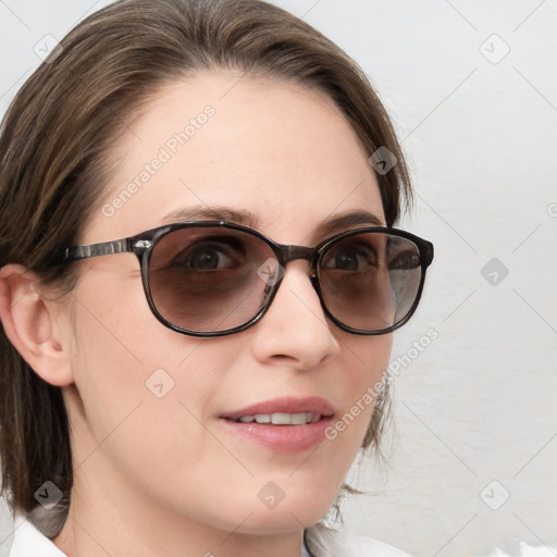 Joyful white young-adult female with medium  brown hair and blue eyes