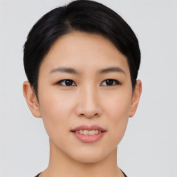 Joyful asian young-adult female with short  black hair and brown eyes