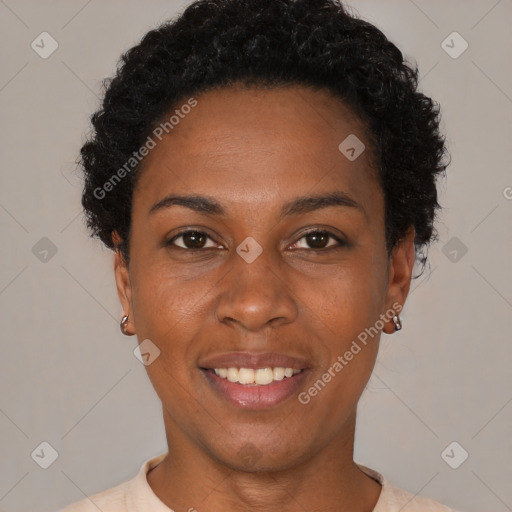 Joyful black young-adult female with short  black hair and brown eyes