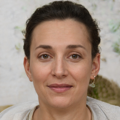 Joyful white adult female with short  brown hair and brown eyes