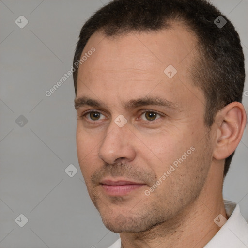 Joyful white adult male with short  brown hair and brown eyes