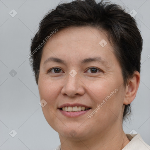 Joyful white adult female with short  brown hair and brown eyes