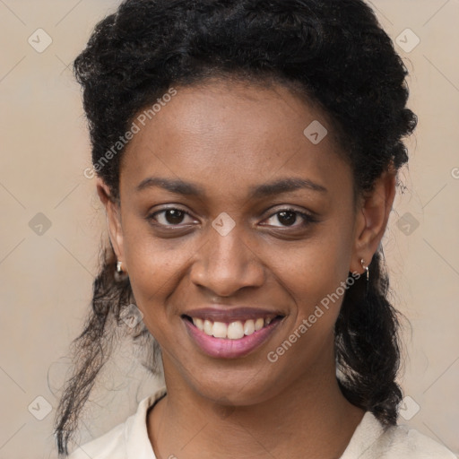 Joyful black young-adult female with medium  black hair and brown eyes