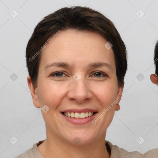 Joyful white adult female with short  brown hair and brown eyes